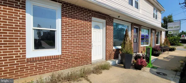 a view of a chair and table in the patio