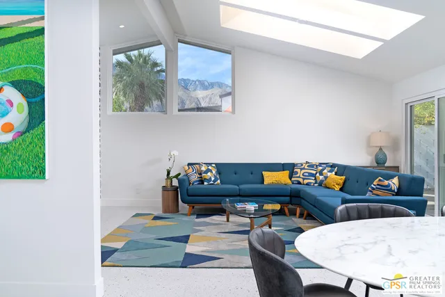 a living room with furniture and a table