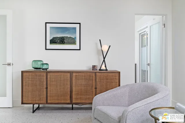 a bedroom with furniture and a window