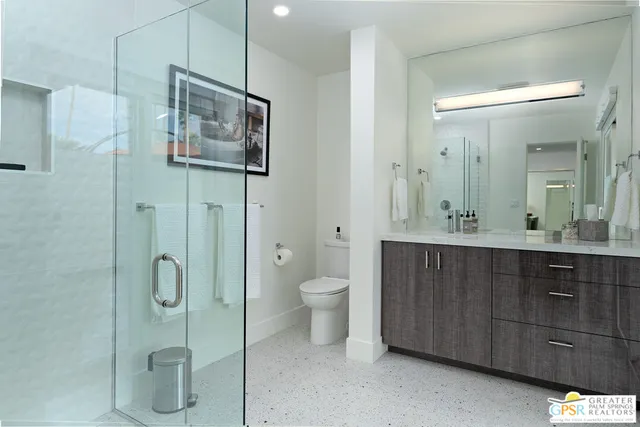 a bathroom with a toilet sink and shower