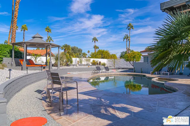 a view of a patio with swimming pool