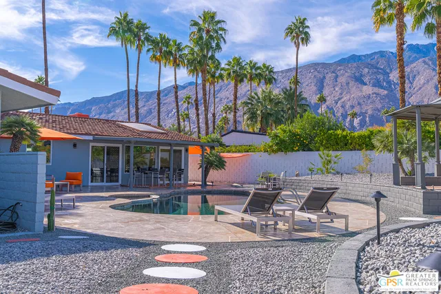 a view of a swimming pool with a patio