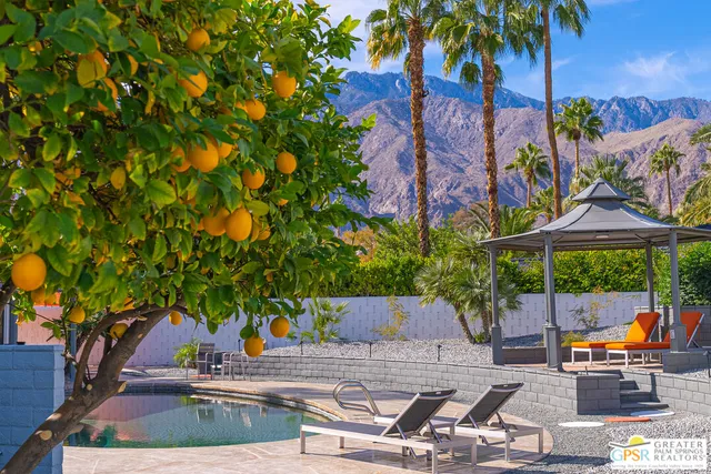 a view of swimming pool with outdoor seating