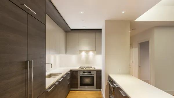 a kitchen with a stove and a refrigerator