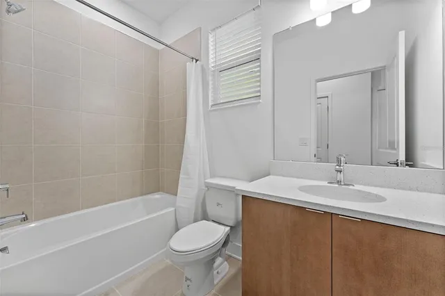 a bathroom with a sink a toilet and a bathtub