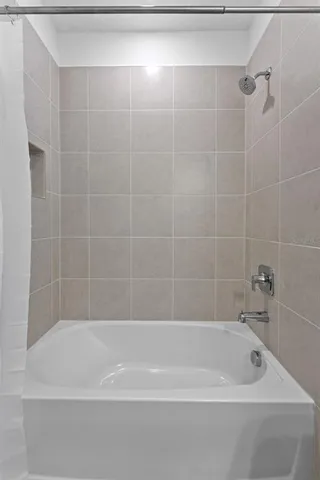 wooden floor with a bedroom and windows