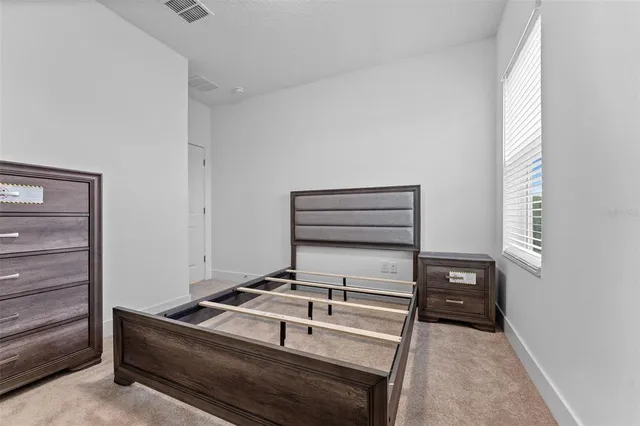 a view of storage and utility room with a window