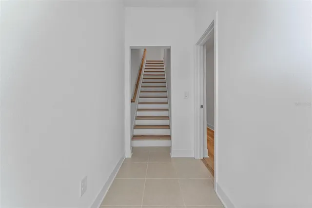 a view of a hallway with stairs