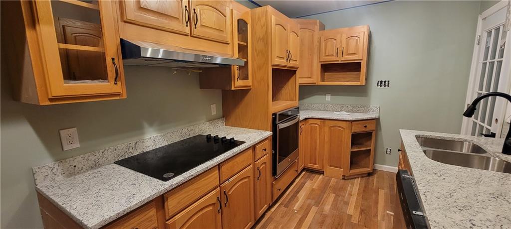 198 Little Summit Road Dunbar, PA 15431 - Photo 6 of 30 a kitchen with stainless steel appliances granite countertop a sink stove and refrigerator