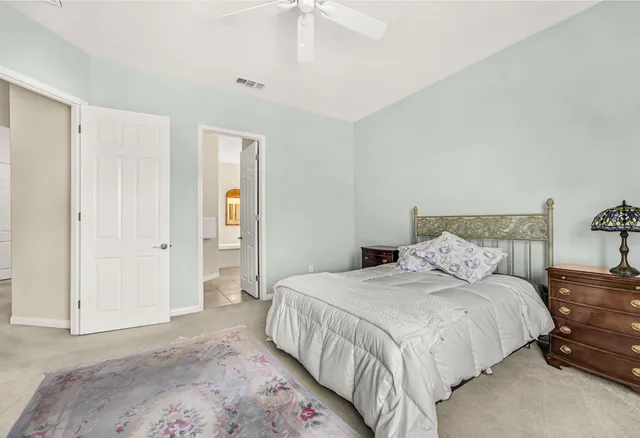 a bedroom with a bed and a dresser