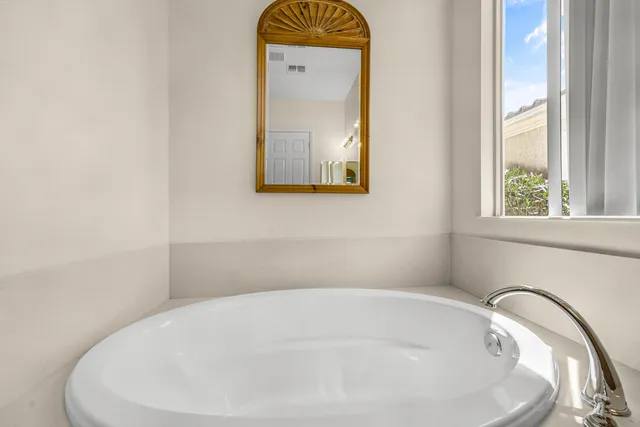 a bathroom with a sink and mirror