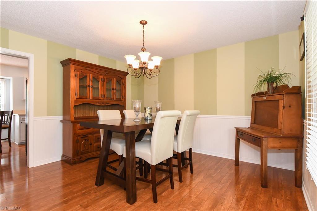 4105 Appleton Road Greensboro, NC 27405 - Photo 11 of 30 Spacious dining room with nice floors and contemporary colors.