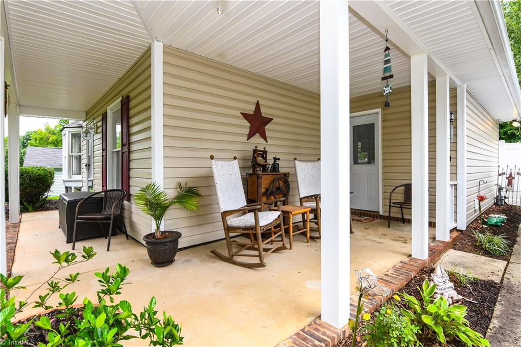 4105 Appleton Road Greensboro, NC 27405 - Photo 4 of 30 Room to rock and read on this porch!