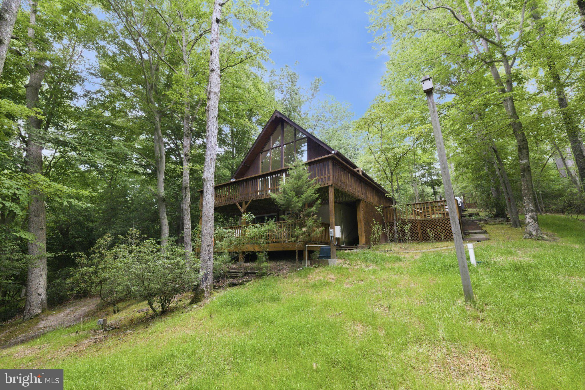 11492 Rawhide Road Lusby, MD 20657 - Photo 3 of 20 Charming woodland retreat awaits you.