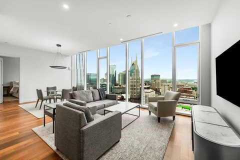 a living room with furniture and a flat screen tv