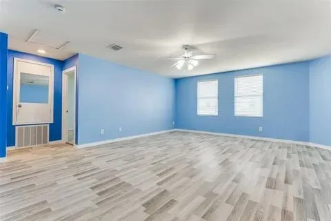 a view of empty room with windows