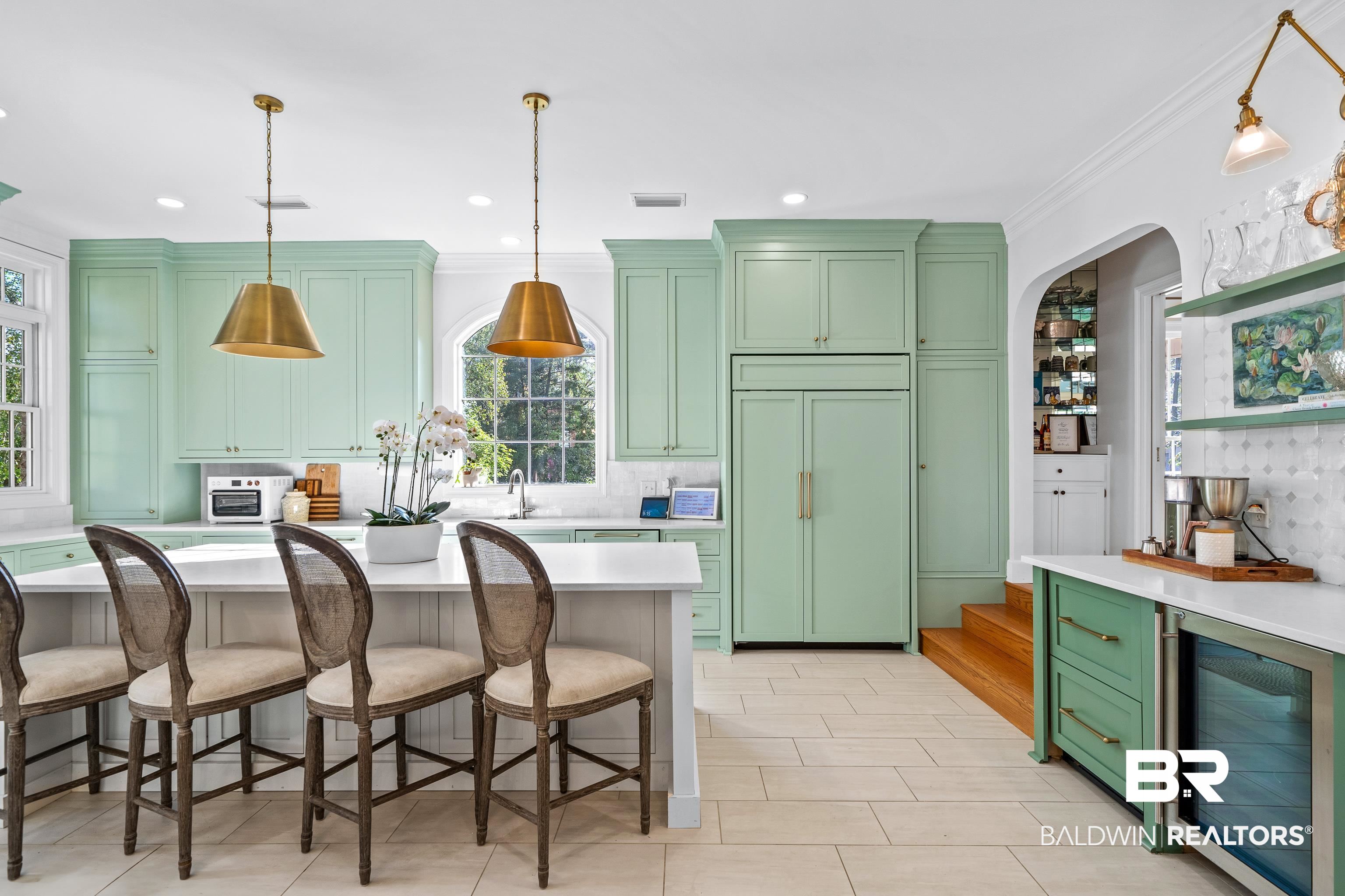 141 Myrtlewood Lane Mobile, AL 36608 - Photo 11 of 44 Kitchen with paneled built in fridge, light countertops, wine cooler, green cabinets, and visible vents