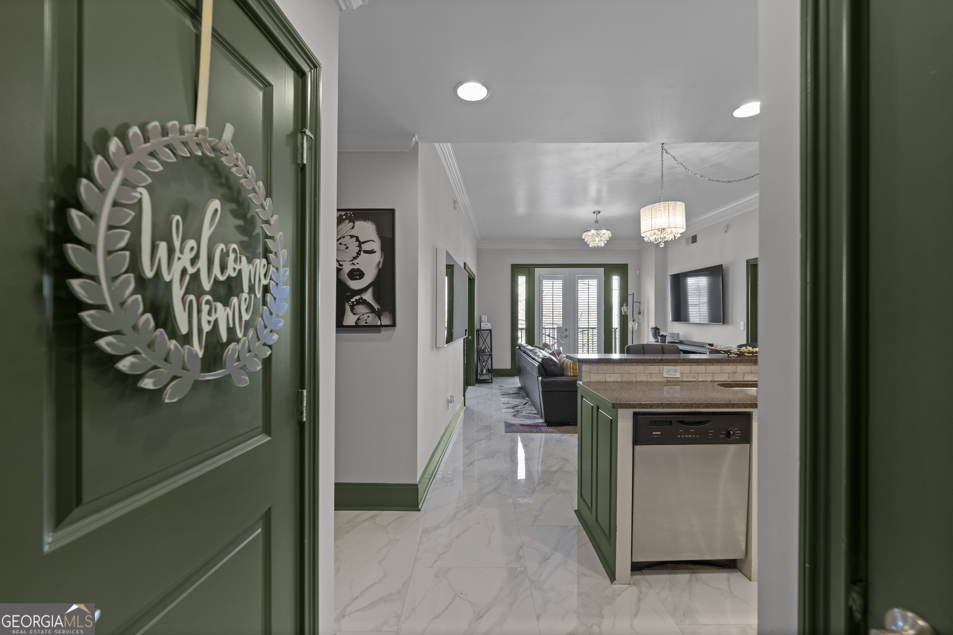 a view of a hallway with entryway and front door