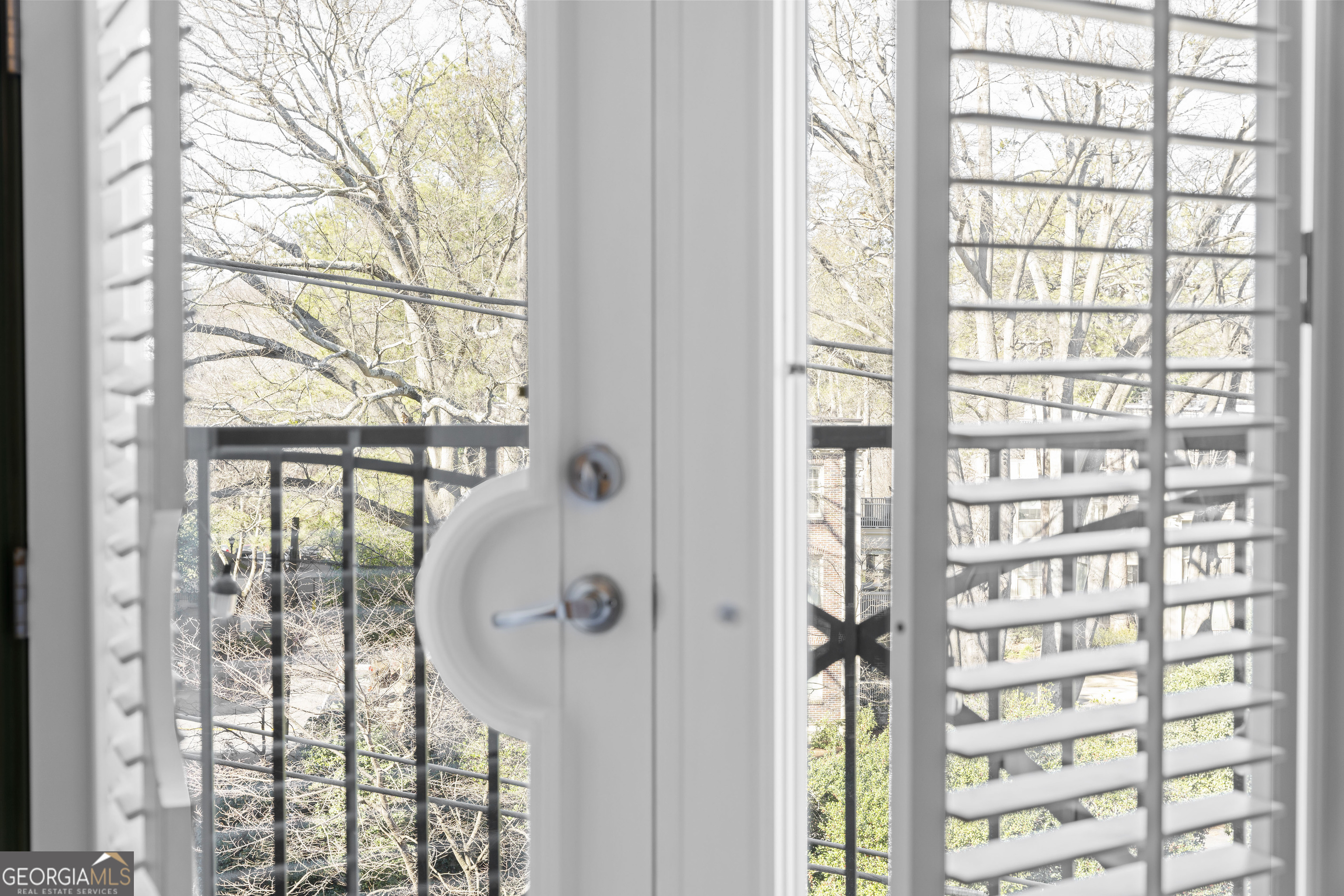 2255 Peachtree Road Northeast, Unit 521 Atlanta, GA 30305 - Photo 11 of 51 a view of a large window with a tree in front of it