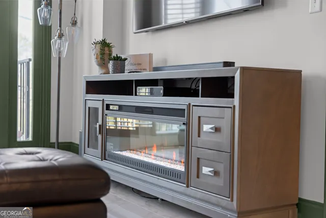 a bedroom with a bed and a fireplace