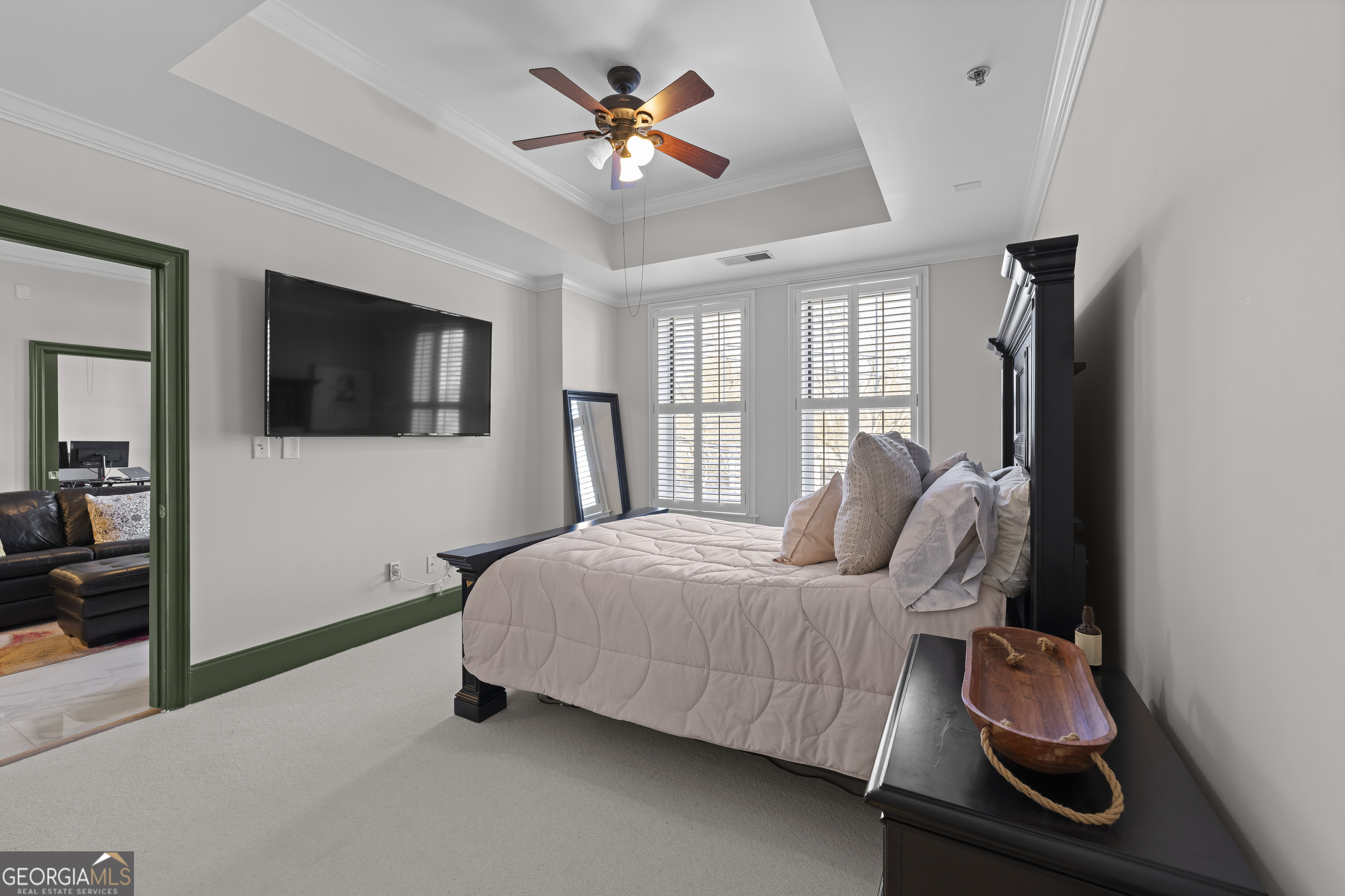 2255 Peachtree Road Northeast, Unit 521 Atlanta, GA 30305 - Photo 18 of 51 a bedroom with a bed and a flat screen tv