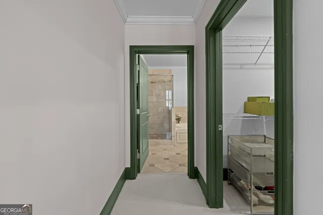 a view of a bathroom from a hallway