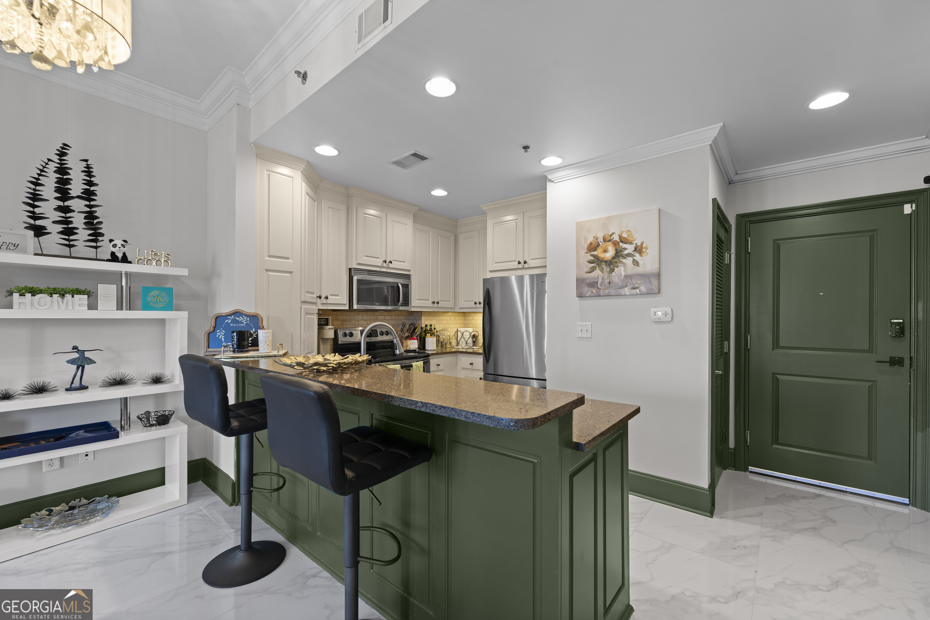 2255 Peachtree Road Northeast, Unit 521 Atlanta, GA 30305 - Photo 2 of 51 a dining hall with stainless steel appliances granite countertop a table and chairs in it