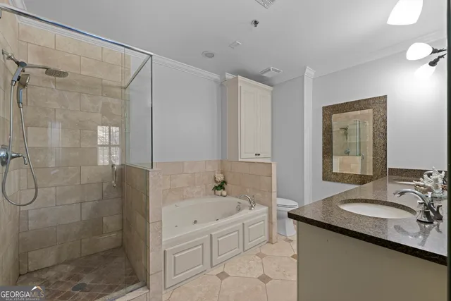 a bathroom with a granite countertop sink a mirror a bathtub and shower