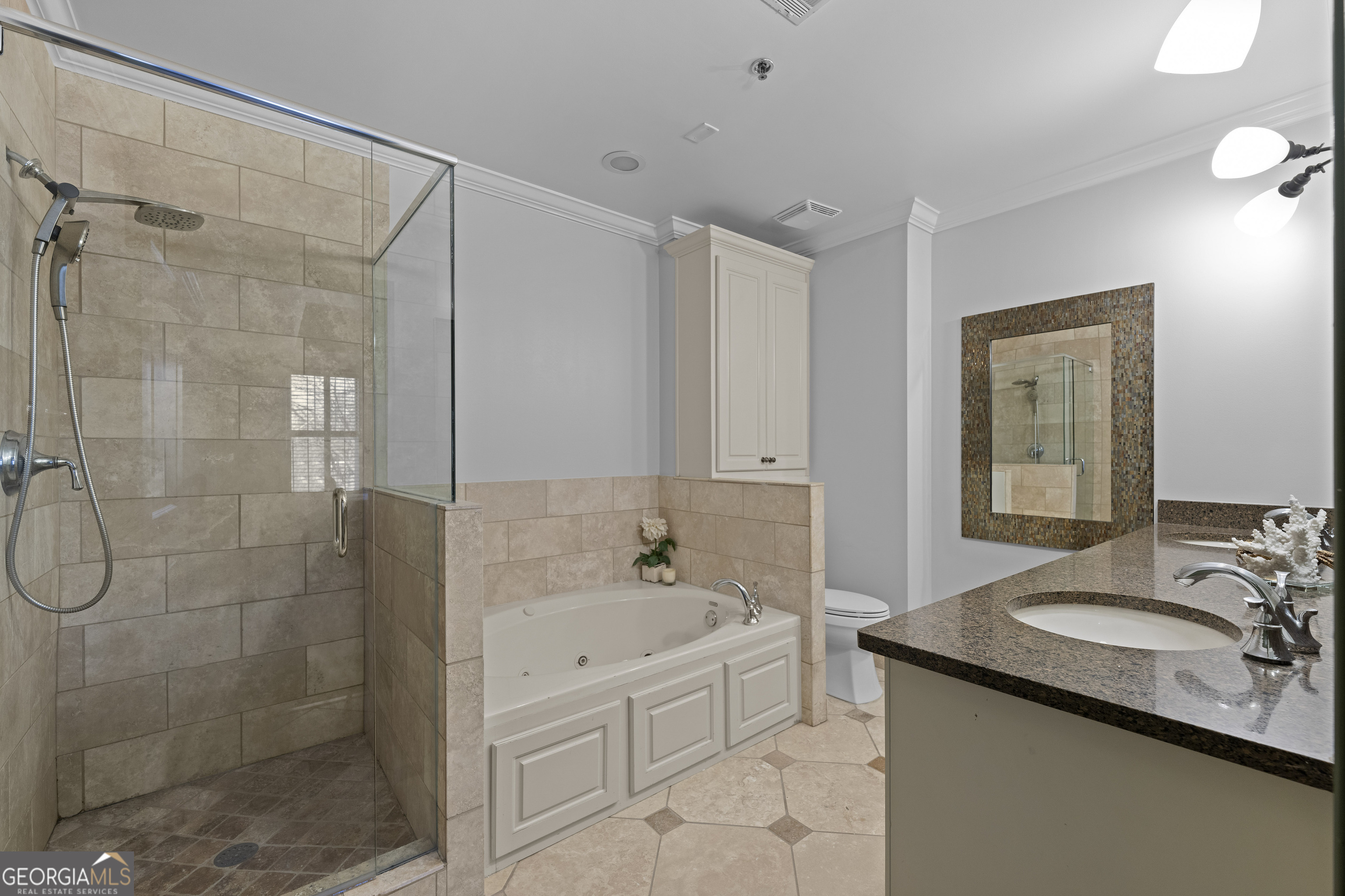 2255 Peachtree Road Northeast, Unit 521 Atlanta, GA 30305 - Photo 22 of 51 a bathroom with a granite countertop sink a mirror a bathtub and shower