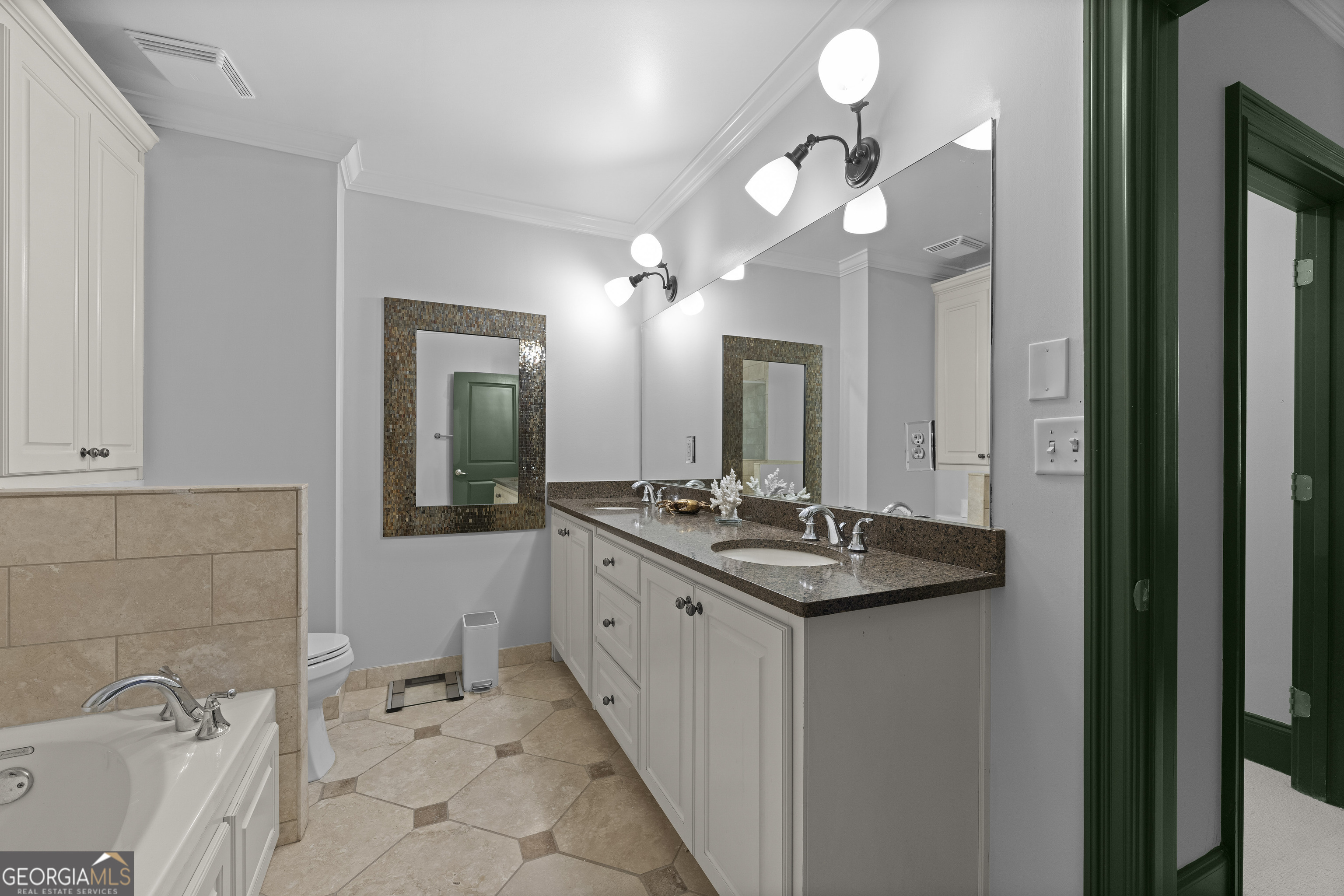 2255 Peachtree Road Northeast, Unit 521 Atlanta, GA 30305 - Photo 25 of 51 a bathroom with a sink and a mirror