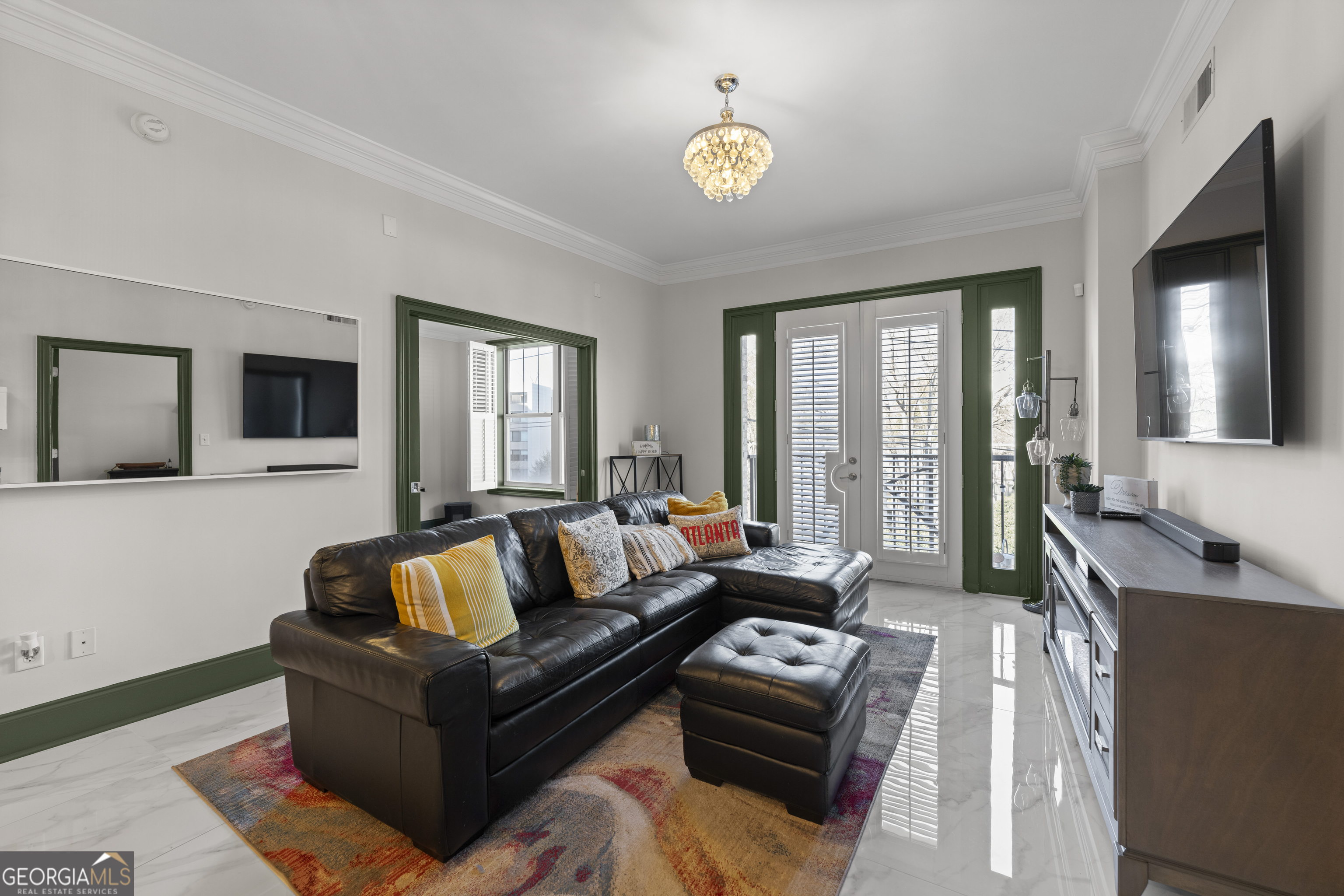 2255 Peachtree Road Northeast, Unit 521 Atlanta, GA 30305 - Photo 26 of 51 a living room with furniture and a flat screen tv