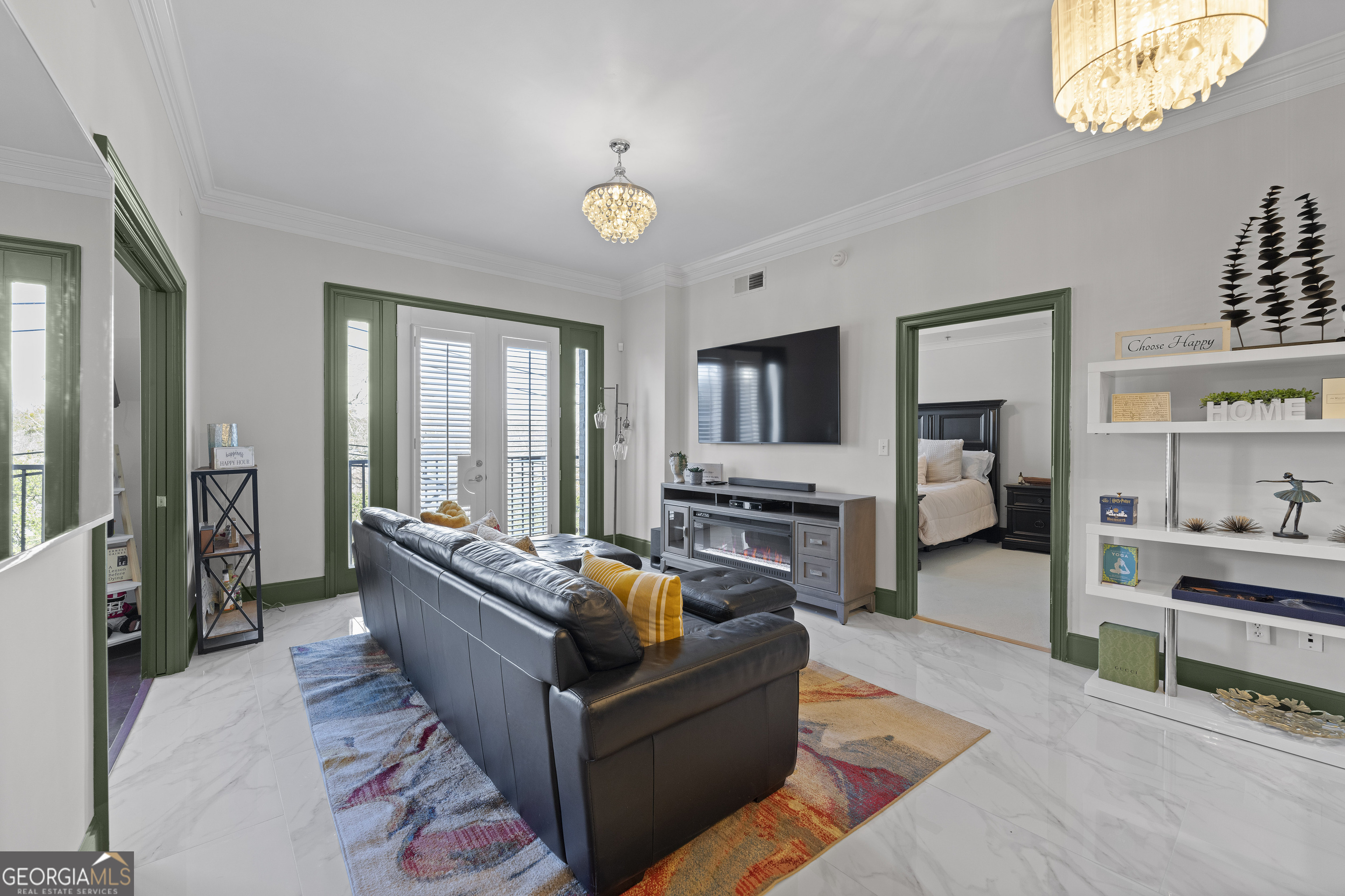 2255 Peachtree Road Northeast, Unit 521 Atlanta, GA 30305 - Photo 3 of 51 a living room with furniture and a flat screen tv