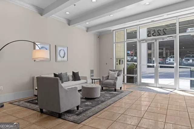 a living room with furniture and a rug