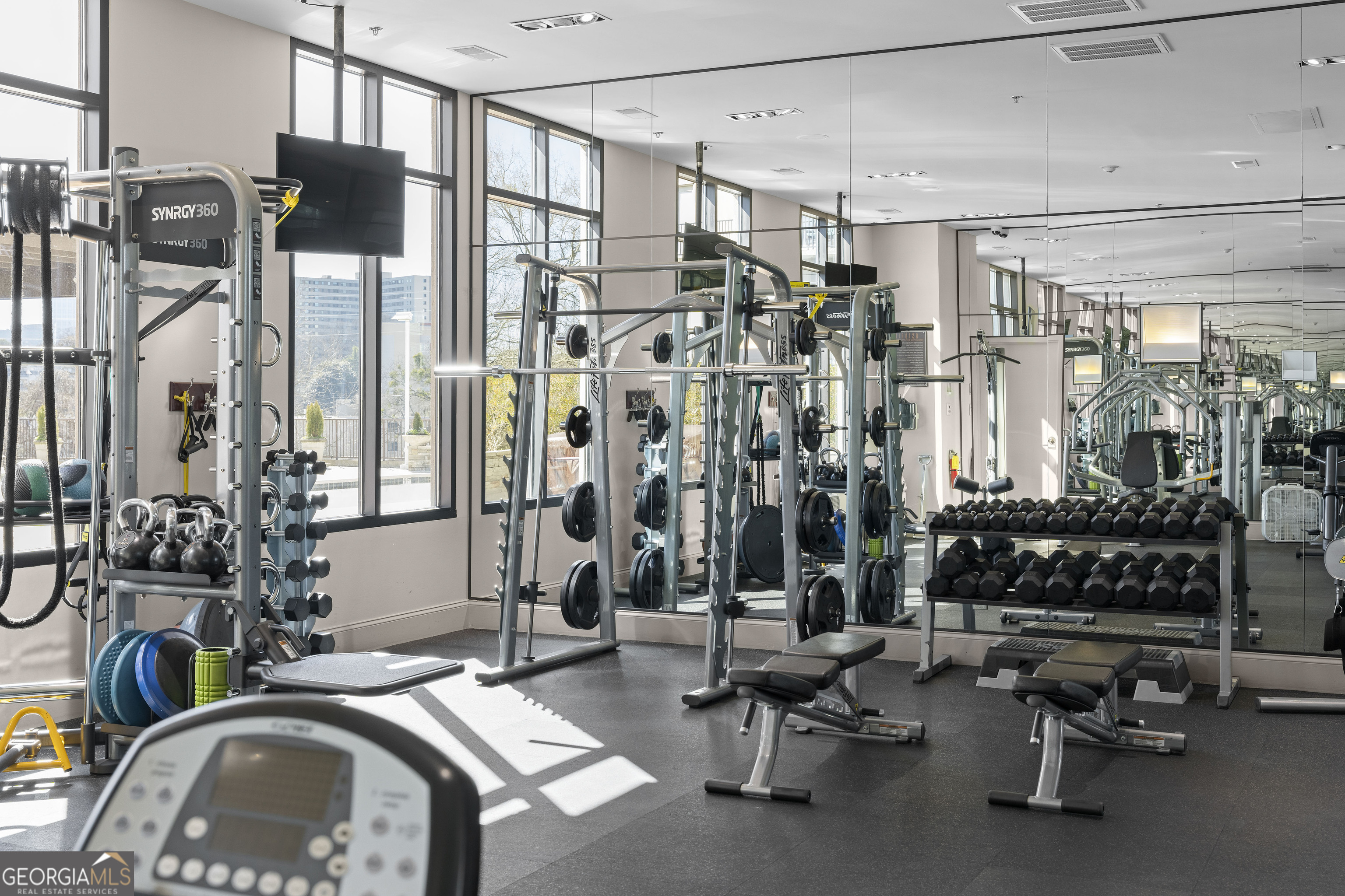 2255 Peachtree Road Northeast, Unit 521 Atlanta, GA 30305 - Photo 40 of 51 a view of a livingroom with furniture and floor to ceiling window
