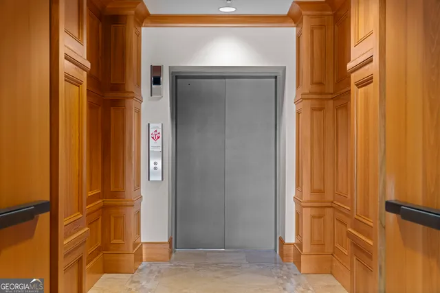 a view of a living room with bathroom