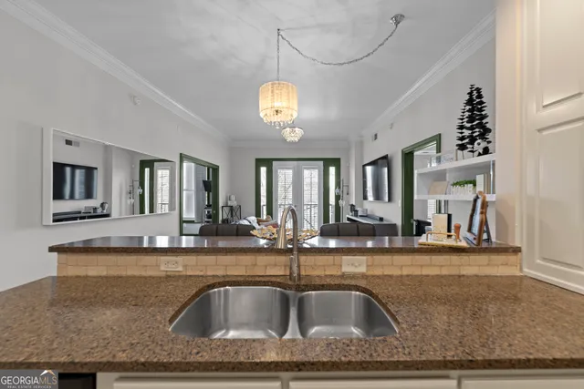 a view of a counter top a sink and dishwasher with kitchen view