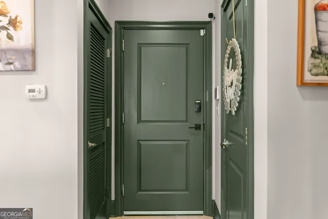 a bathroom with a glass shower door and a shower