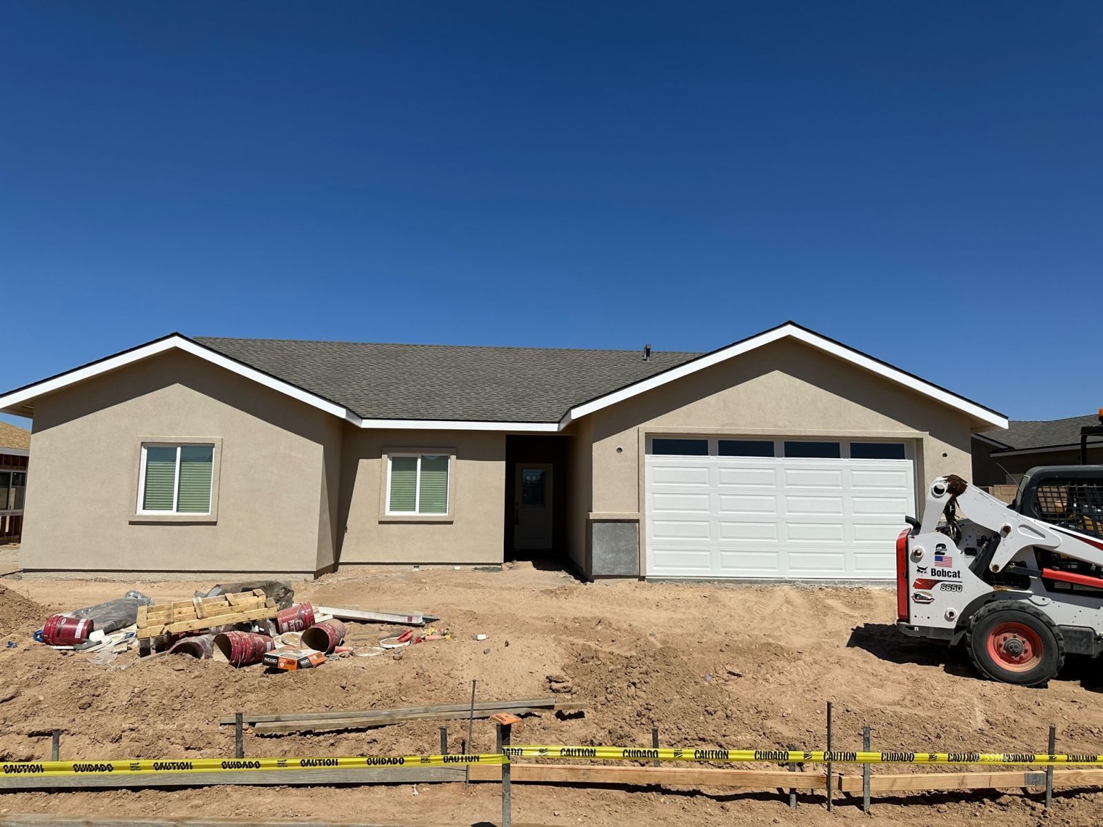 400 Abigail Street Ridgecrest, CA 93555 - Photo 2 of 36 a front view of a house with garage