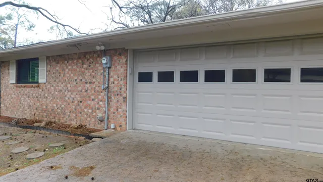 a view of a house with a large window