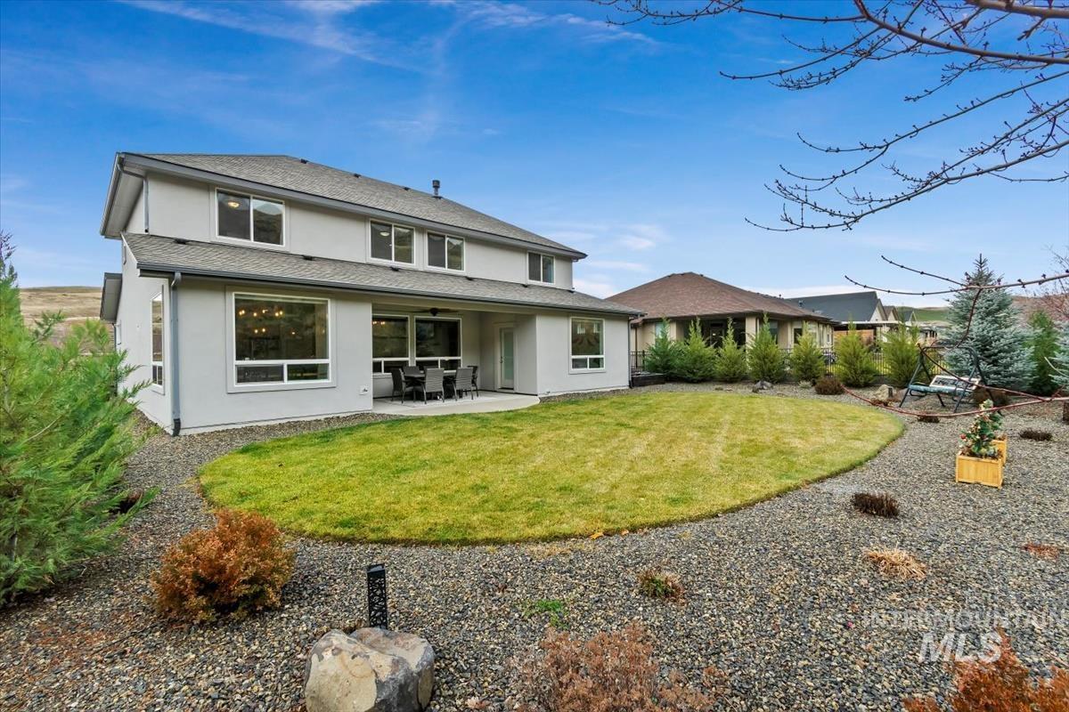 20530 North Shepherds Pie Way Boise, ID 83714 - Photo 34 of 47 Back of property with a patio area, stucco siding, and a lawn
