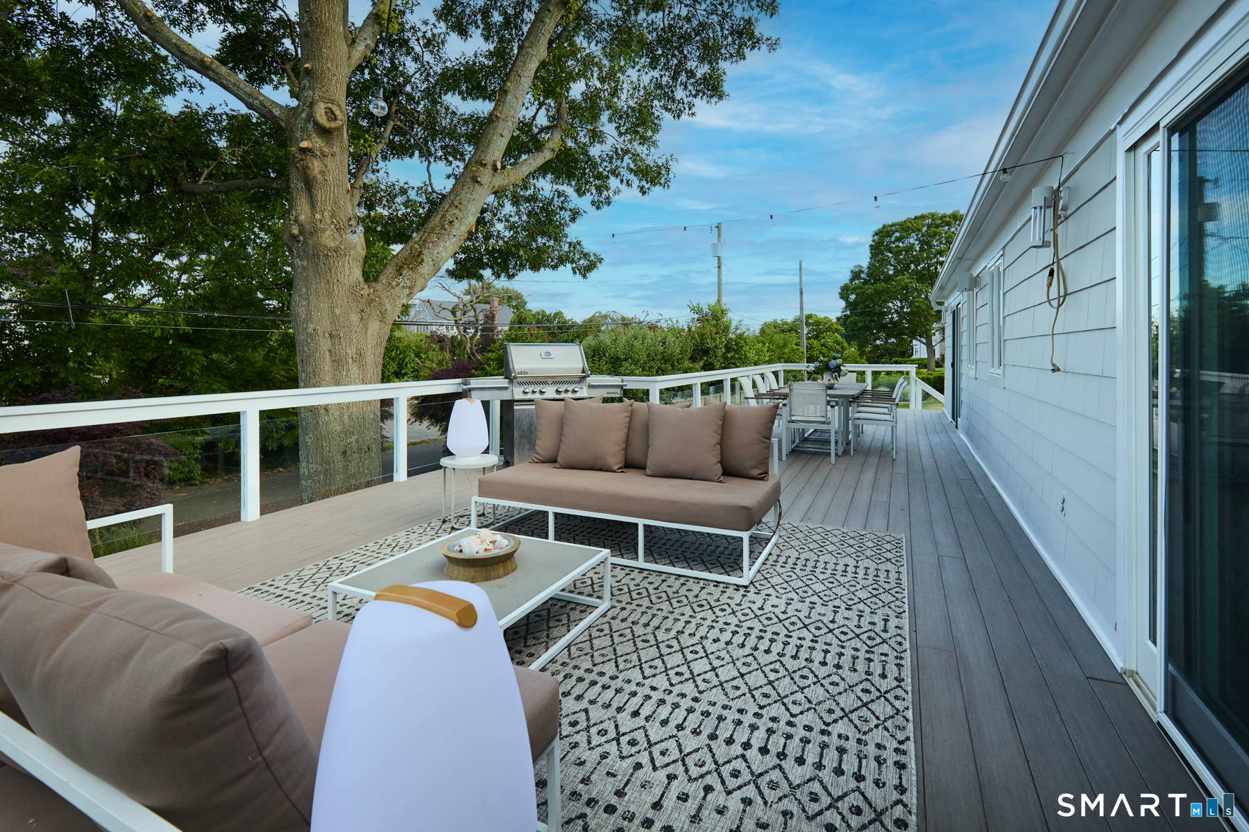 16 Harbor Road Westport, CT 06880 - Photo 27 of 36 a balcony with wooden floor and outdoor seating