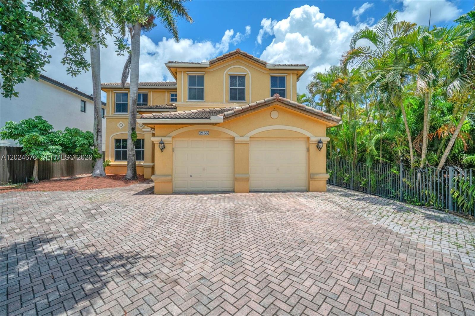 2155 Southwest 156th Court Miami, FL 33185 - Photo 1 of 57 a front view of a house with a yard and garage