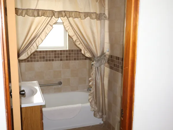 a bathroom with a bathtub and a shower