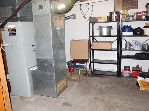a view of living room kitchen and utility room
