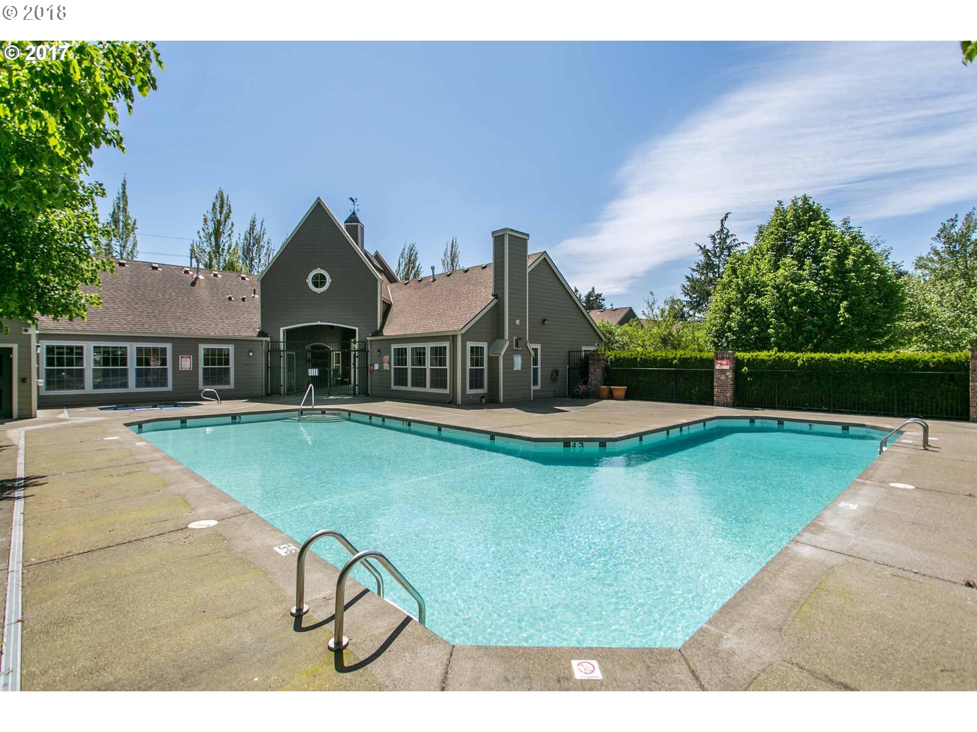 7123 Southwest Sagert Street, Unit 101 Tualatin, OR 97062 - Photo 20 of 24 a view of a house with swimming pool