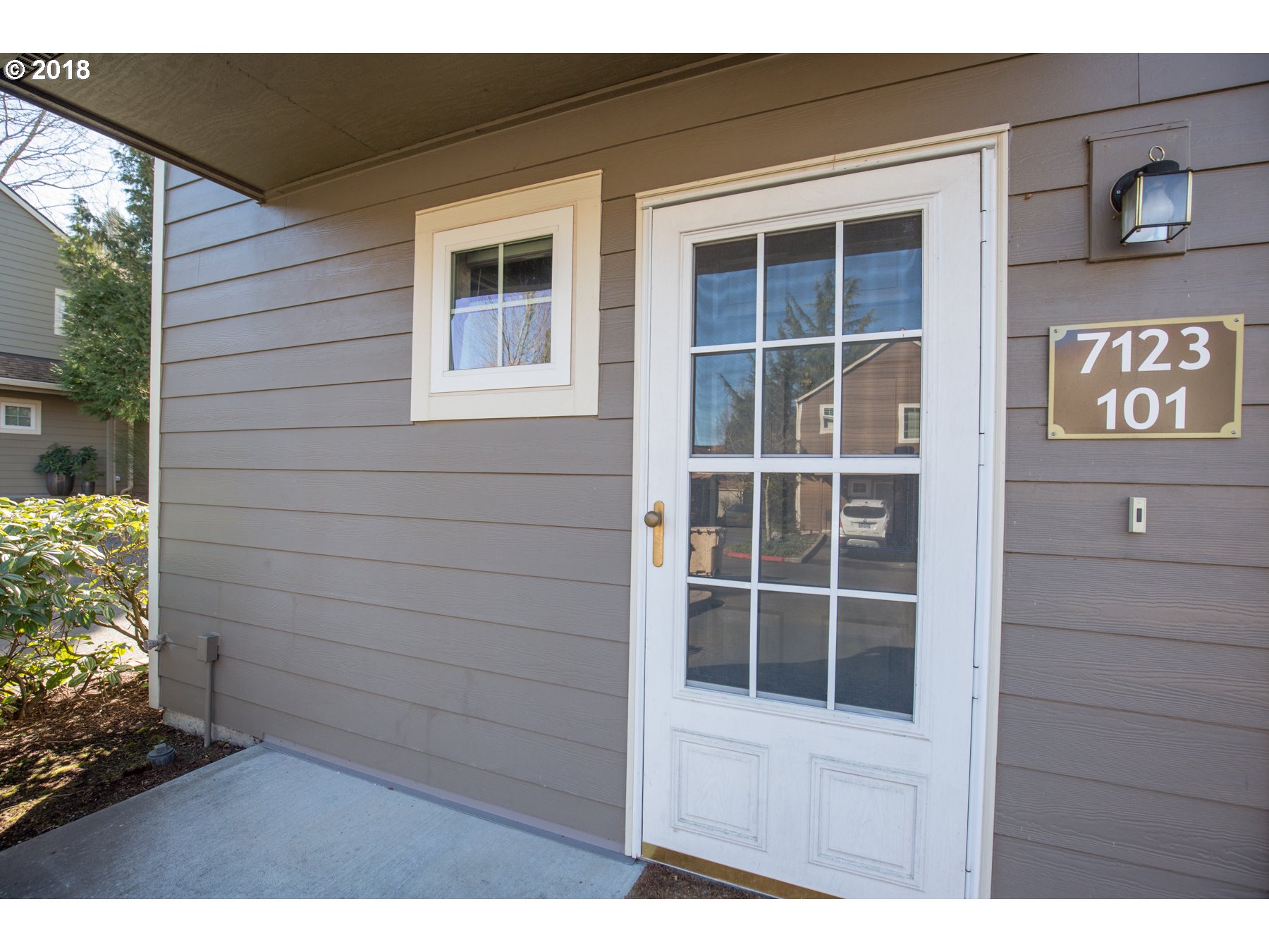 7123 Southwest Sagert Street, Unit 101 Tualatin, OR 97062 - Photo 2 of 24 a view of front door