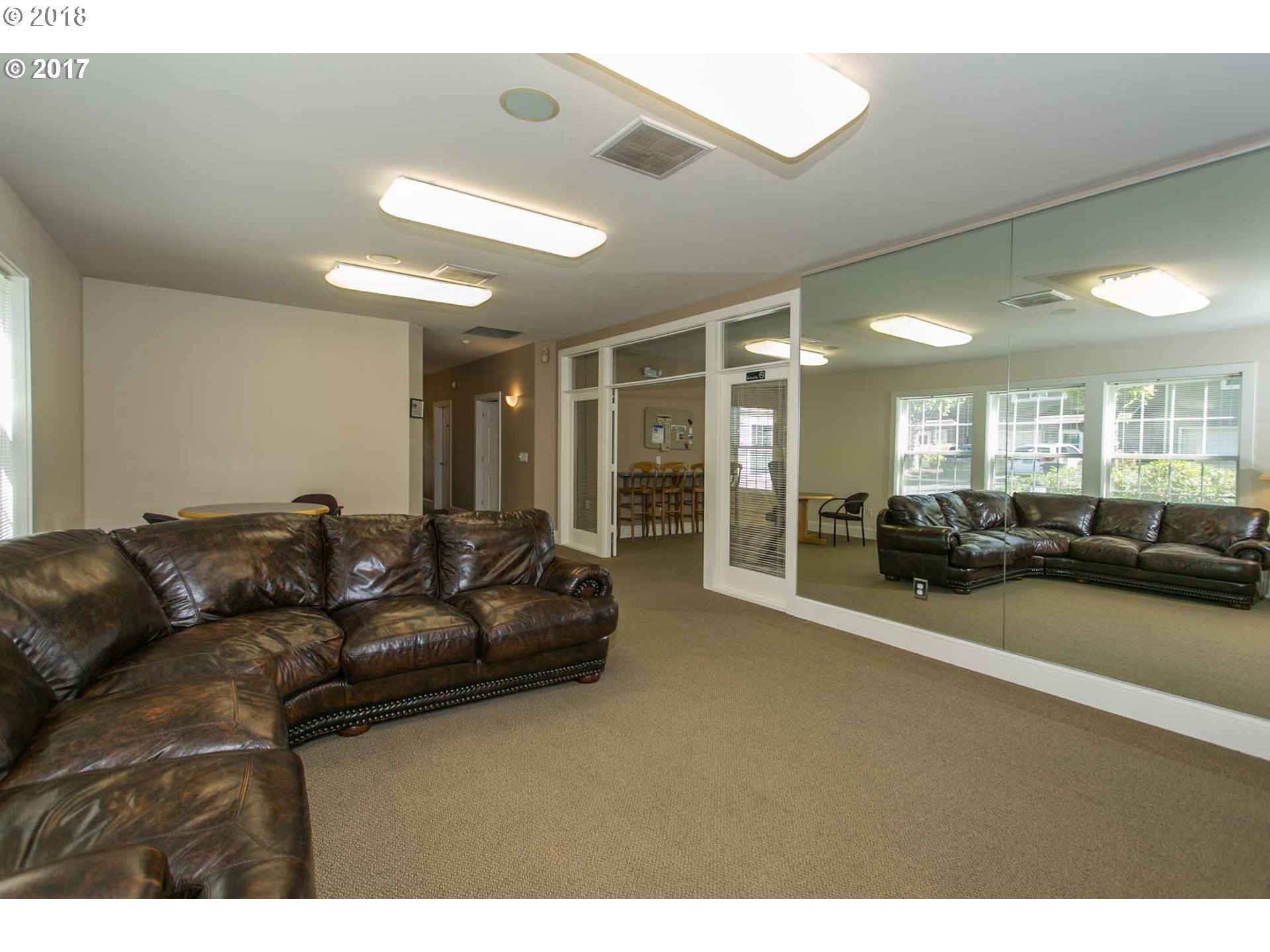7123 Southwest Sagert Street, Unit 101 Tualatin, OR 97062 - Photo 22 of 24 a living room with furniture and a large window
