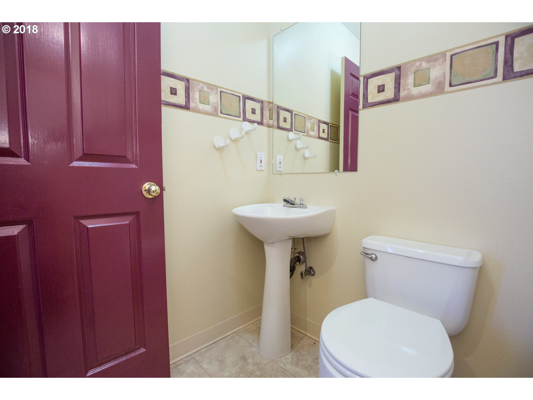7123 Southwest Sagert Street, Unit 101 Tualatin, OR 97062 - Photo 6 of 24 a bathroom with a sink toilet
