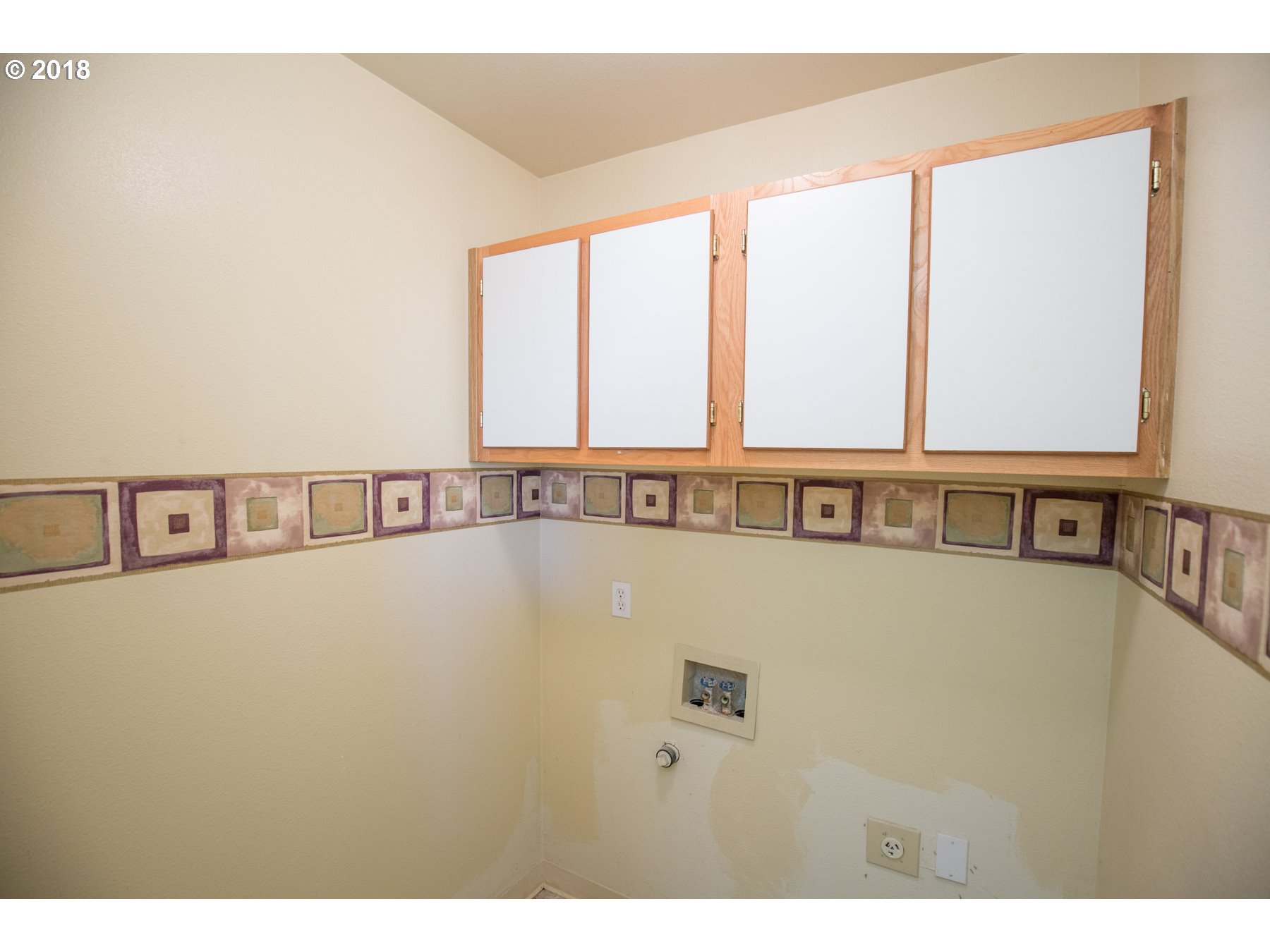 7123 Southwest Sagert Street, Unit 101 Tualatin, OR 97062 - Photo 7 of 24 a view of a kitchen with an empty space