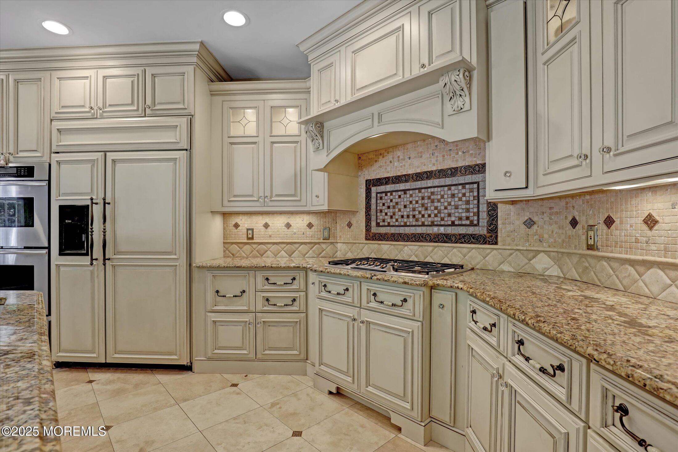 26 Bruns Road West Allenhurst, NJ 07711 - Photo 18 of 66 a kitchen with stainless steel appliances granite countertop a stove and a refrigerator